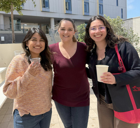 three advisors drinking coffee