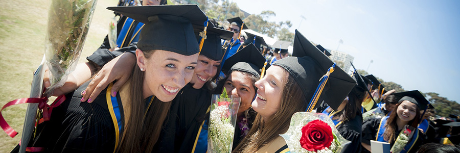 students celebrating graduation