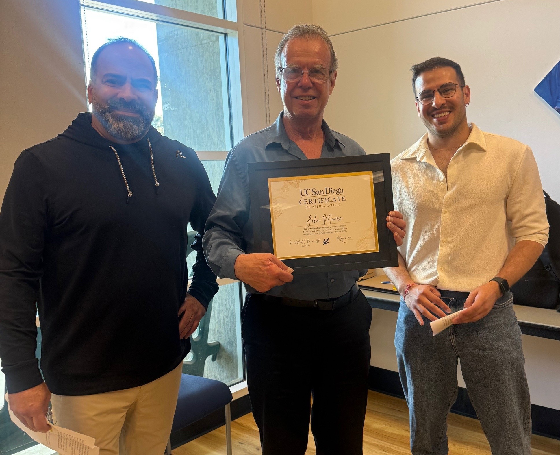 three advisors with award